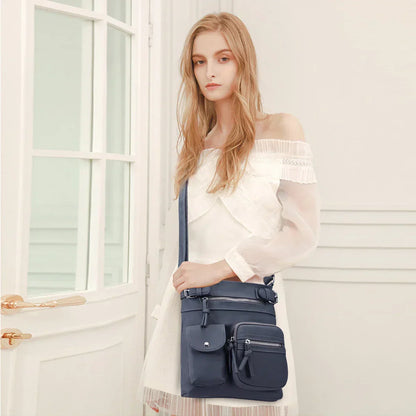 Zara | Sac à bandoulière en cuir souple à compartiments multiples.